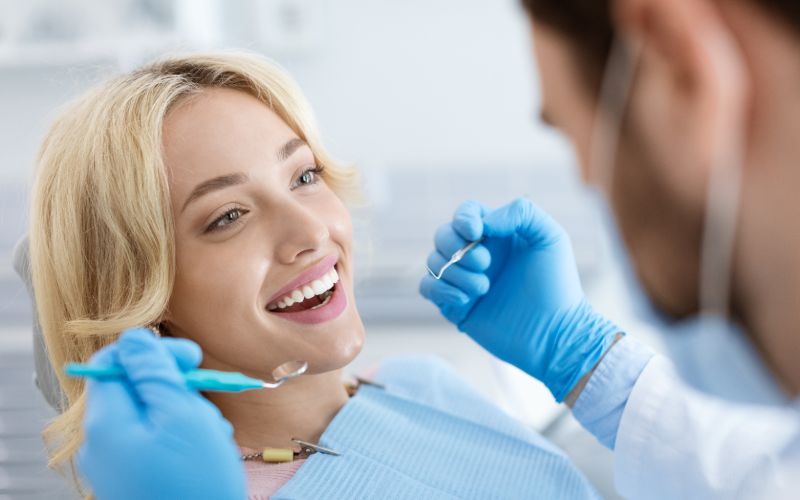 woman getting her teeth inspected by the dentist